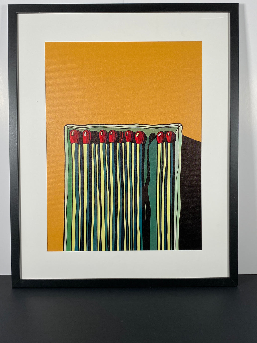 "Matchbox Dreams" Canvas Art Piece in Modern Black Frame and White Matte.