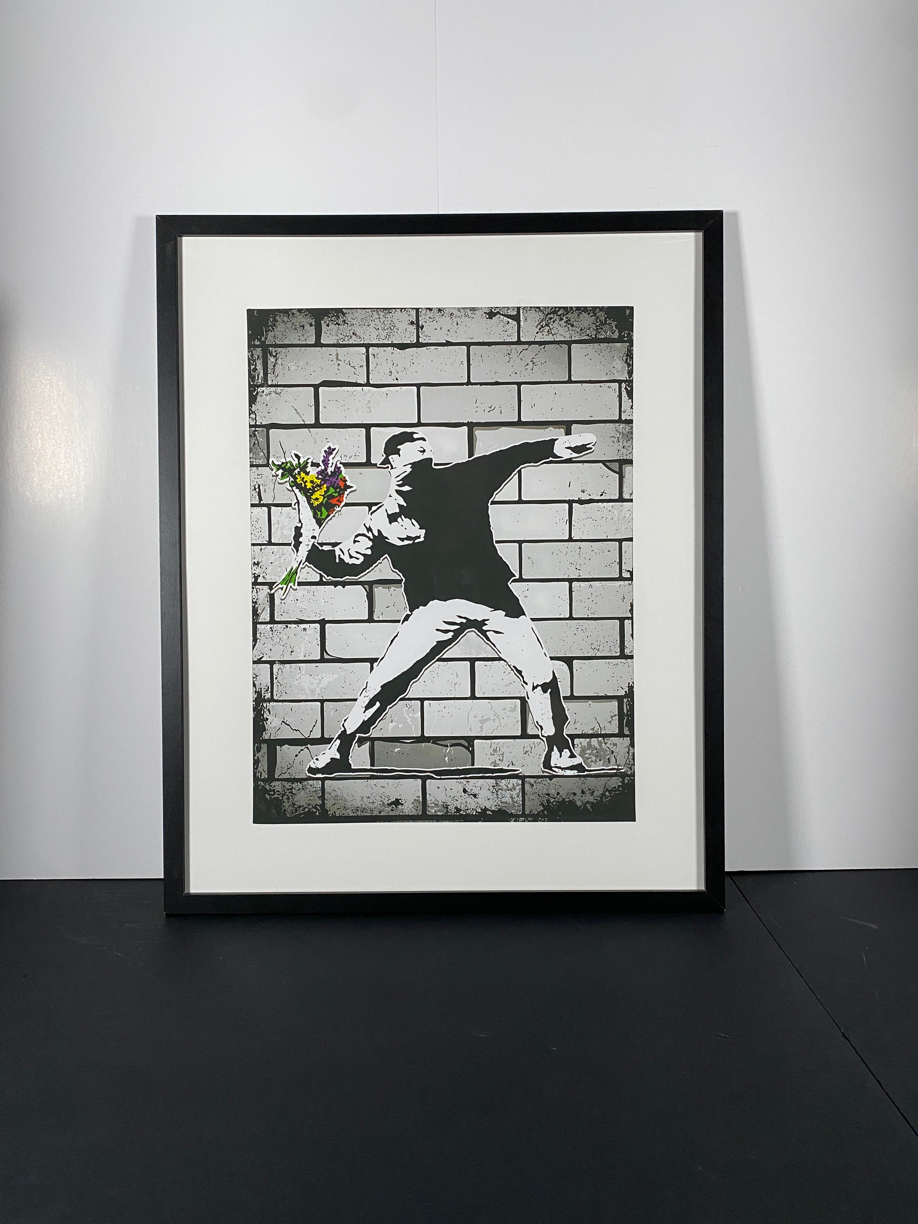 "Flower Bomber" - Bansky Canvas Art Piece in Modern Black Frame